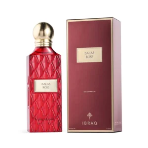 Balas Rose by Ibraheem Al Qurashi EDP perfume bottle on a luxurious velvet surface with fresh roses and raspberries